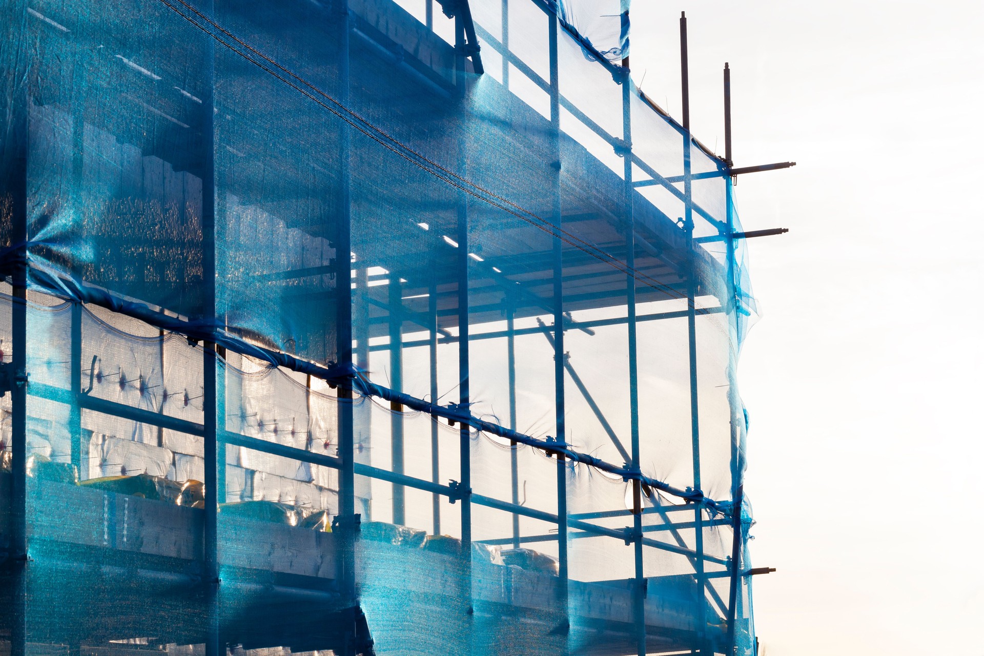 Blue scaffolding with safety netting