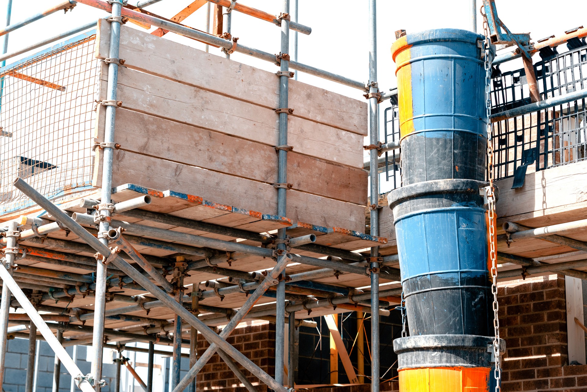 Scaffold platform installed around working area to provide safe platform and loading bay for bricklayers